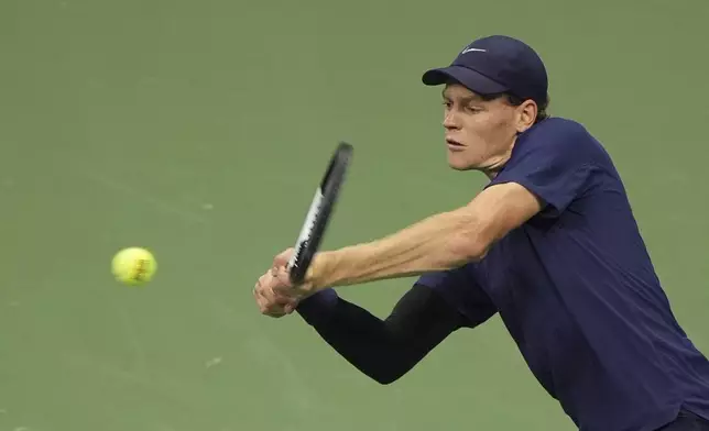 Jannik Sinner, of Italy, returns a shot against Felix Auger-Aliassime, of Canada, during the men's singles semifinals of the U.S. Open tennis championships, Friday, Sept. 5, 2025, in New York. (AP Photo/Seth Wenig)