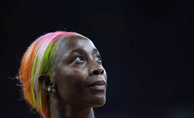 Jamaica's Shelly-Ann Fraser-Pryce looks up after finishing a women's 100 meters heat at the World Athletics Championships in Tokyo, Saturday, Sept. 13, 2025. (AP Photo/Petr David Josek)