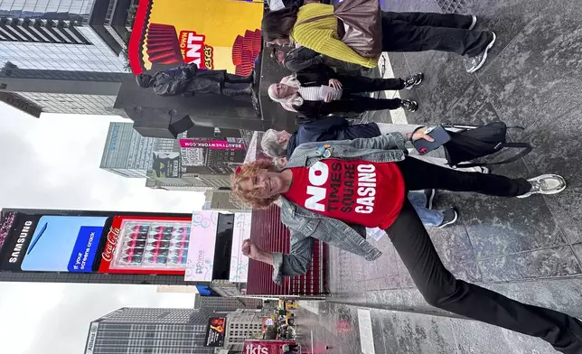 Joanne Borts, a local resident, actor and musician who opposes a casino planned for Times Square, stands in the famed Manhattan tourist destination on Wednesday, Sept. 17, 2025. (AP Photo/Philip Marcelo)