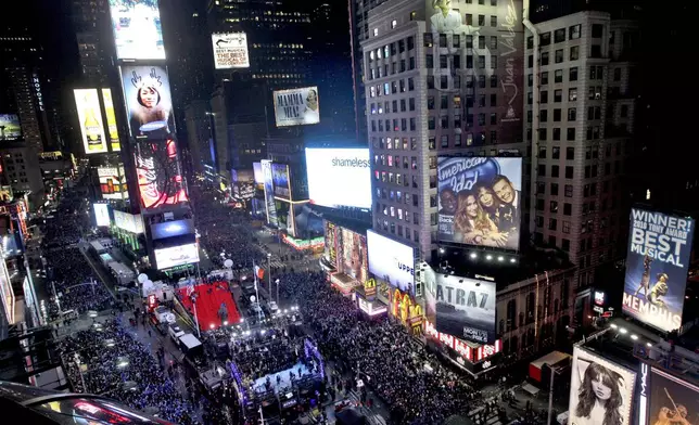 FILE - In this Dec. 31, 2011 file photo, the crowd packs New York's Times Square during the New Year's Eve celebration as seen from the Marriott Marquis hotel. (AP Photo/Mary Altaffer, File)