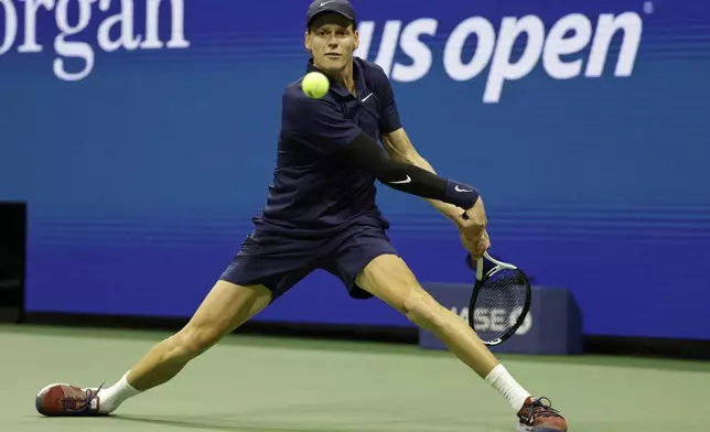 Jannik Sinner, of Italy, returns a shot to Lorenzo Musetti, of Italy, during the quarterfinal round of the U.S. Open tennis championships, Wednesday, Sept. 3, 2025, in New York. (AP Photo/Adam Hunger)