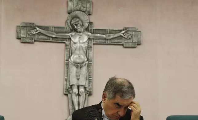FILE — Cardinal Angelo Becciu talks to journalists during news conference in Rome, Sept. 25, 2020. (AP Photo/Gregorio Borgia, File)