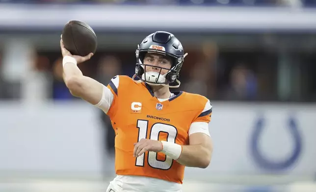 Denver Broncos quarterback Bo Nix throws before an NFL football game against the Indianapolis Colts, Sunday, Sept. 14, 2025, in Indianapolis. (AP Photo/Michael Conroy)