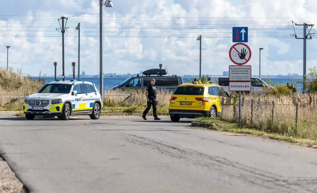 Danish police and Danish Security and Intelligence Service (PET) are present at DSB on Kystvejen by Copenhagen Airport, Tuesday, Sept. 23, 2025, after drones flew over Copenhagen Airport on Monday evening and the airspace was closed for four hours. (Steven Knap/Ritzau Scanpix via AP)