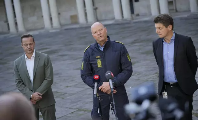 Naviair Director Morten Fruensgaard, left, police inspector Jens Jespersen, centre, and operations manager at Naviair Kristoffer Plenge-Brandt hold a joint press conference at police headquarters in Copenhagen, Denmark, Tuesday Sept. 23, 2025, after drones were seen on Monday evening near Copenhagen Airport and the airspace over Copenhagen was closed for four hours into Tuesday. (Emil Helms/Ritzau Scanpix via AP)