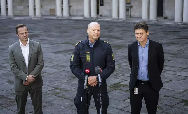 Naviair Director Morten Fruensgaard, left, police inspector Jens Jespersen, centre, and operations manager at Naviair Kristoffer Plenge-Brandt hold a joint press conference at police headquarters in Copenhagen, Denmark, Tuesday Sept. 23, 2025, after drones were seen on Monday evening near Copenhagen Airport and the airspace over Copenhagen was closed for four hours into Tuesday. (Emil Helms/Ritzau Scanpix via AP)