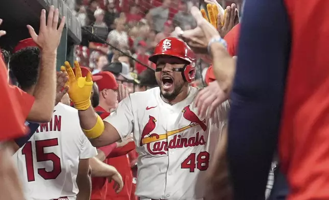 St. Louis Cardinals' Ivan Herrera is congratulated by teammates after hitting a two-run home run during the sixth inning of a baseball game against the Athletics Tuesday, Sept. 2, 2025, in St. Louis. (AP Photo/Jeff Roberson)