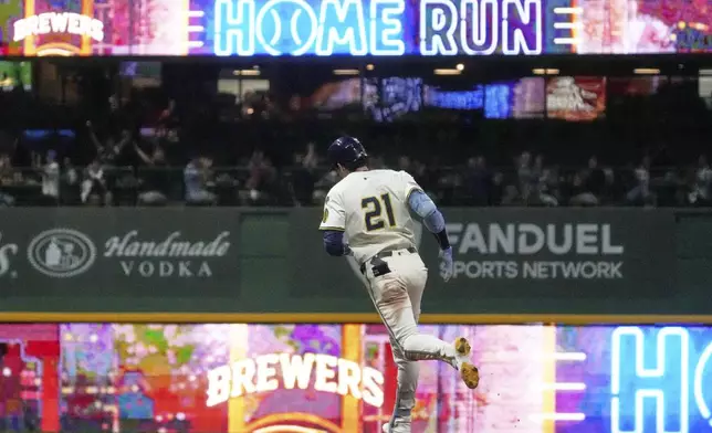 Milwaukee Brewers' Christian Yelich is rounds the bases after hitting a two-run home run during the fourth inning of a baseball game against the Los Angeles Angels Tuesday, Sept. 16, 2025, in Milwaukee. (AP Photo/Morry Gash)