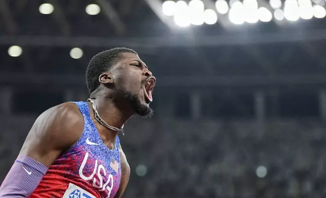 United States' Cordell Tinch wins the gold in the men's 110 meters hurdles final at the World Athletics Championships in Tokyo, Tuesday, Sept. 16, 2025. (AP Photo/Petr David Josek)