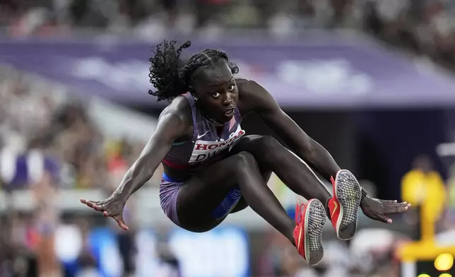 United States' Agur Dwol makes an attempt in the women's triple jump qualification at the World Athletics Championships in Tokyo, Tuesday, Sept. 16, 2025. (AP Photo/Matthias Schrader)