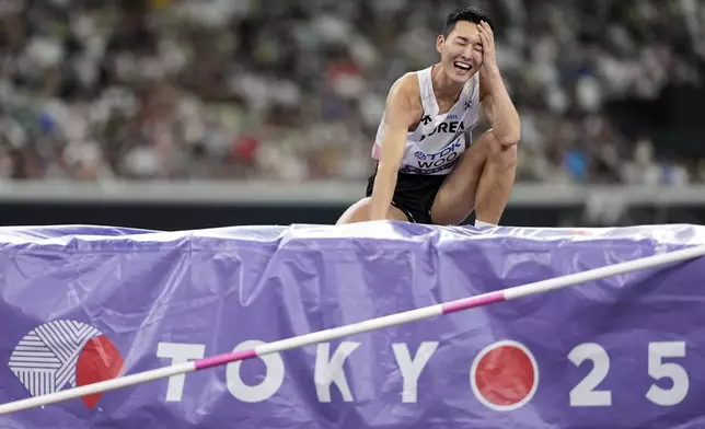 South Korea's Woo Sang-hyeok reacts after an attempt in the men's high jump final at the World Athletics Championships in Tokyo, Tuesday, Sept. 16, 2025. (AP Photo/Matthias Schrader)