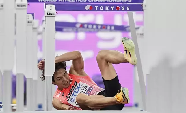 Japan's Shunsuke Izumiya crashes in a men's 110 meters hurdles semifinal at the World Athletics Championships in Tokyo, Tuesday, Sept. 16, 2025. (AP Photo/Petr David Josek)
