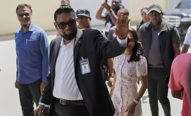 President Irfaan Ali, who is running for re-election, waves after voting during general elections in Leonora, Guyana, Monday, Sept. 1, 2025.(AP Photo/Matias Delacroix)