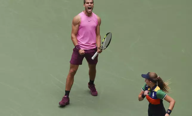 Carlos Alcaraz, of Spain, reacts after defeating Jiri Lehecka, of the Czech Republic, during the quarterfinal round of the U.S. Open tennis championships, Tuesday, Sept. 2, 2025, in New York. (AP Photo/Heather Khalifa)