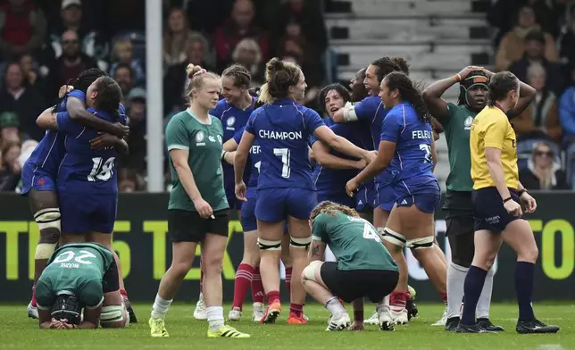 France's players celebrate following a Women's Rugby World Cup 2025 quarterfinal match between France and Ireland, in Exeter, England, Sunday, Sept. 14, 2025. (AP Photo/Alastair Grant)