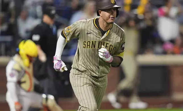 San Diego Padres' Manny Machado runs the bases after hitting a grand slam during the fifth inning of a baseball game against the New York Mets Wednesday, Sept. 17, 2025, in New York. (AP Photo/Frank Franklin II)
