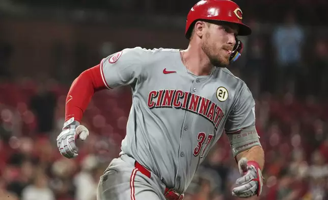 Cincinnati Reds' Tyler Stephenson rounds first on his way three-run double during the ninth inning of a baseball game against the St. Louis Cardinals Monday, Sept. 15, 2025, in St. Louis. (AP Photo/Jeff Roberson)
