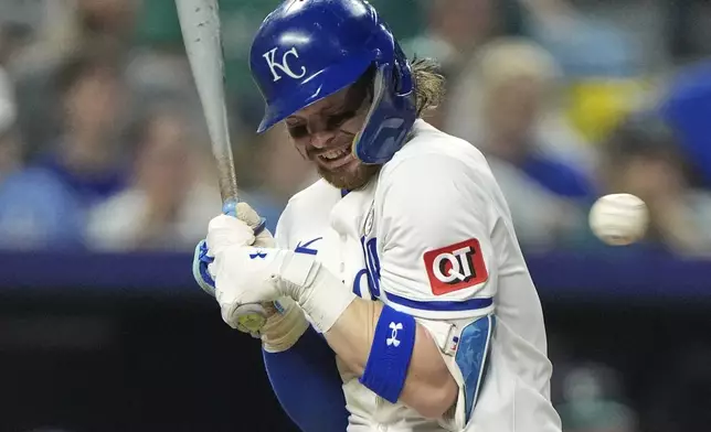 Kansas City Royals' Bobby Witt Jr. reacts after being hit by a pitch thrown by Seattle Mariners relief pitcher Luke Jackson during the eighth inning of a baseball game Tuesday, Sept. 16, 2025, in Kansas City, Mo. (AP Photo/Charlie Riedel)