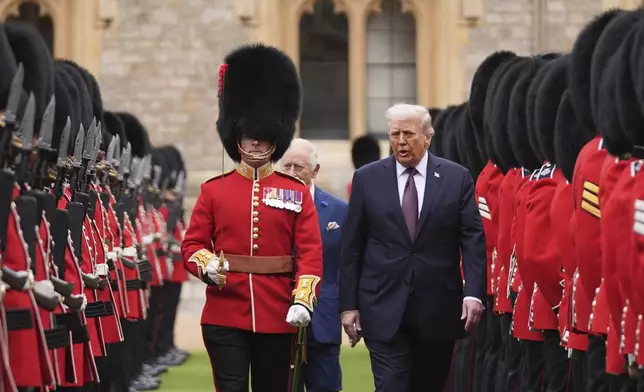 President Donald Trump and Britain's King Charles III inspect the guard of honor during an arrival ceremony at Windsor Castle, in Windsor, England, Wednesday, Sept. 17, 2025. (AP Photo/Evan Vucci)