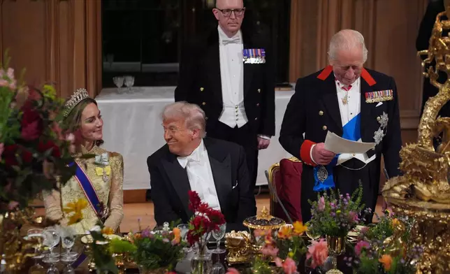 U.S. President Donald Trump, centre, and Kate, Princess of Wales, listens to Britain's King Charles during the State Banquet in Windsor Castle, England, on day one of U.S. President Donald Trump and First Lady Melania Trump's second state visit to the UK, Wednesday Sept. 17, 2025. (Yui Mok/PA via AP, Pool Photo via AP)