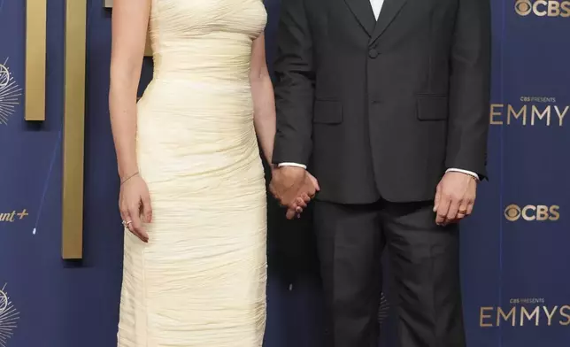 Scarlett Johansson, left, and Colin Jost arrive at the 77th Primetime Emmy Awards on Sunday, Sept. 14, 2025, at the Peacock Theater in Los Angeles. (AP Photo/Jae C. Hong)