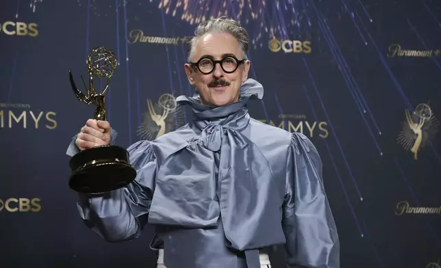 Alan Cumming, winner of the award for outstanding reality competition program for "The Traitors," poses in the press room during the 77th Primetime Emmy Awards on Sunday, Sept. 14, 2025, at the Peacock Theater in Los Angeles. (Photo by Richard Shotwell/Invision/AP)