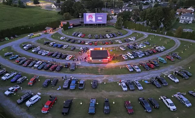 The sunsets on the Shankweiler Drive-In as previews run before the feature film "Jaws" in Orefield, Pa., Friday, Aug. 29, 2025. (AP Photo/Gene J. Puskar)