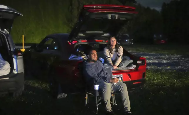 A couple watches the movie "Jaws" at the Shankweiler Drive-In in Orefield, Pa., Friday, Aug. 29, 2025. (AP Photo/Gene J. Puskar)