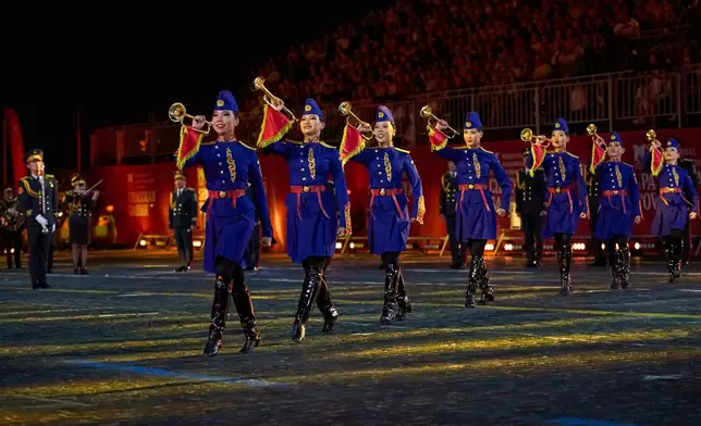 Members of the Mongolian Military Song and Dance Ensemble perform during the closing ceremony of the Spasskaya Tower International Military Music Festival in Red Square in front of the St. Basil Cathedral in Moscow, Russia, on Sunday, Aug. 31, 2025. (AP Photo/Alexander Zemlianichenko)