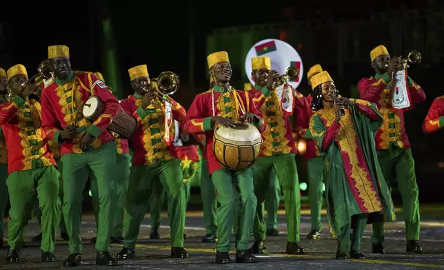 Members of The Presidential Orchestra of Burkina Faso perform during the closing ceremony of the Spasskaya Tower International Military Music Festival in Red Square in front of the St. Basil Cathedral in Moscow, Russia, on Sunday, Aug. 31, 2025. (AP Photo/Alexander Zemlianichenko)