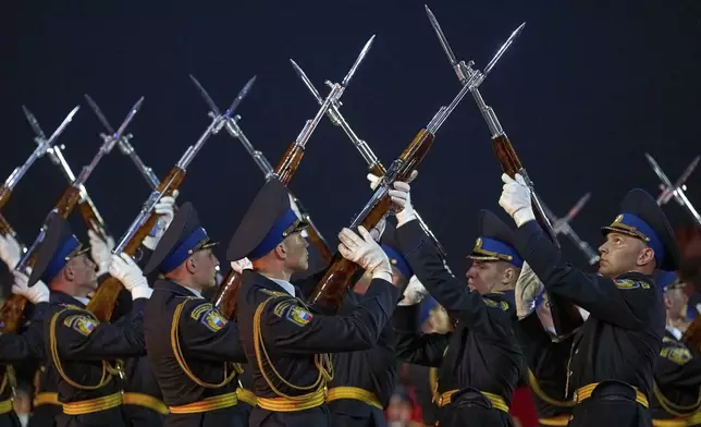 The Honor Guard of the Presidential Regiment of the Moscow Kremlin Commandant's Service of the Federal Guard Service of the Russian Federation perform during the closing ceremony of the Spasskaya Tower International Military Music Festival in Red Square in front of the St. Basil Cathedral in Moscow, Russia, on Sunday, Aug. 31, 2025. (AP Photo/Alexander Zemlianichenko)