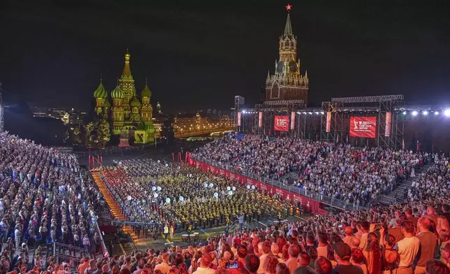 A combined military band of the participating countries performs during the closing ceremony of the Spasskaya Tower International Military Music Festival in Red Square in front of the St. Basil Cathedral in Moscow, Russia, on Sunday, Aug. 31, 2025. (AP Photo/Alexander Zemlianichenko)