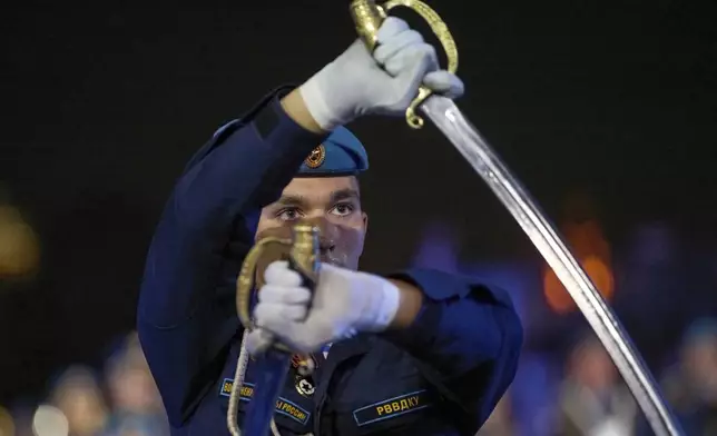A Russian soldier of the the Combined Military Band of the Russian Airborne Forces performs during the closing ceremony of the Spasskaya Tower International Military Music Festival in Red Square in front of the St. Basil Cathedral in Moscow, Russia, on Sunday, Aug. 31, 2025. (AP Photo/Alexander Zemlianichenko)