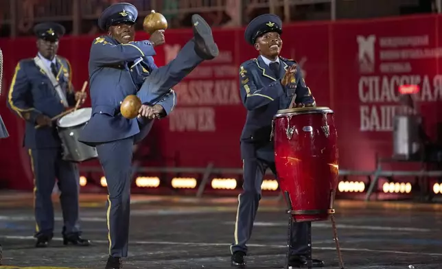 Members of the Zimbabwe Defence Forces Band perform during the closing ceremony of the Spasskaya Tower International Military Music Festival in Red Square in front of the St. Basil Cathedral in Moscow, Russia, on Sunday, Aug. 31, 2025. (AP Photo/Alexander Zemlianichenko)