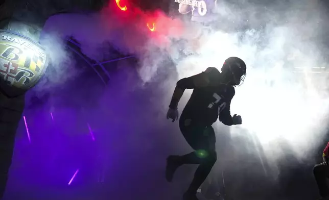 Baltimore Ravens offensive tackle Roger Rosengarten is introduced onto the field prior to an NFL football game against the Detroit Lions Monday, Sept. 22, 2025, in Baltimore. (AP Photo/Stephanie Scarbrough)