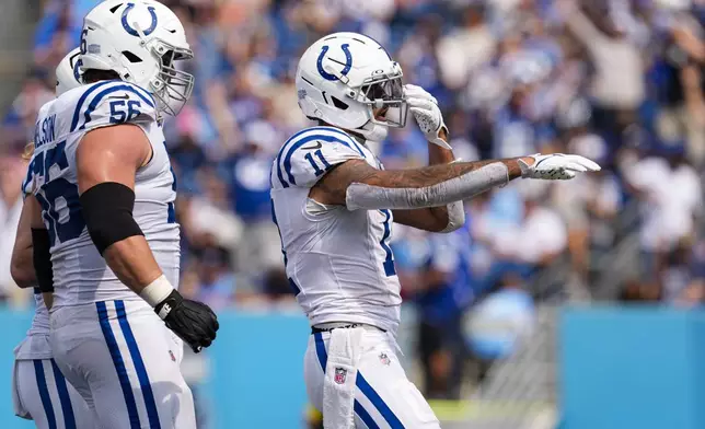 Indianapolis Colts wide receiver Michael Pittman (11) celebrates a touchdown against the Tennessee Titans during the second half of an NFL football game Sunday, Sept. 21, 2025, in Nashville, Tenn. (AP Photo/George Walker IV)