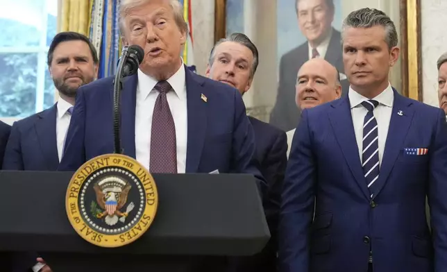 President Donald Trump speaks about the relocation of U.S. Space Command headquarters from Colorado to Alabama in the Oval Office of the White House, Tuesday, Sept. 2, 2025, in Washington, as Vice President JD Vance and Defense Secretary Pete Hegseth listen. (AP Photo/Mark Schiefelbein)