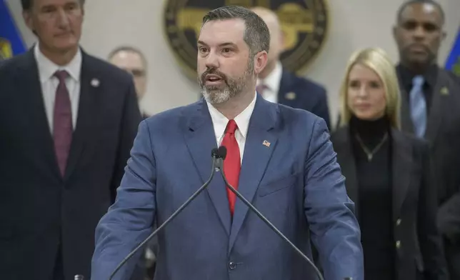 FILE - Erik Siebert, interim U.S. Attorney for the eastern district of Virginia, speaks as Attorney General Pam Bondi, right, and Virginia Gov. Glenn Youngkin, left, listen during a news conference at the Manassas FBI Field Office, March 27, 2025, in Manassas, Va. (AP Photo/Rod Lamkey, Jr., File)