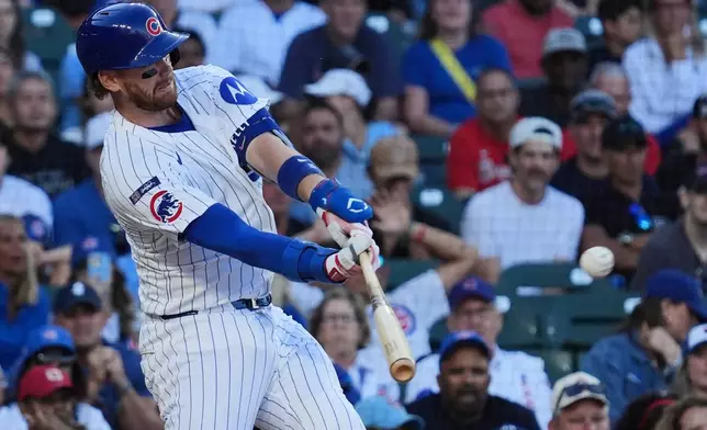 Chicago Cubs' Carson Kelly hits a two-run home run during the eighth inning of a baseball game against the Atlanta Braves in Chicago, Monday, Sept. 1, 2025. (AP Photo/Nam Y. Huh)