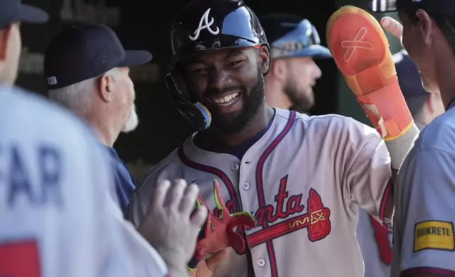 Atlanta Braves' Michael Harris II celebrates with teammates after scoring on a one-run double by Nacho Alvarez Jr. during the fifth inning of a baseball game against the Chicago Cubs in Chicago, Monday, Sept. 1, 2025. (AP Photo/Nam Y. Huh)
