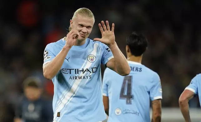 Manchester City's Erling Haaland celebrates after scoring the opening goal during the Champions League opening phase soccer match between Manchester City and Napoli at the Etihad Stadium in Manchester, England, Thursday, Sept. 18, 2025. (AP Photo/Dave Thompson)