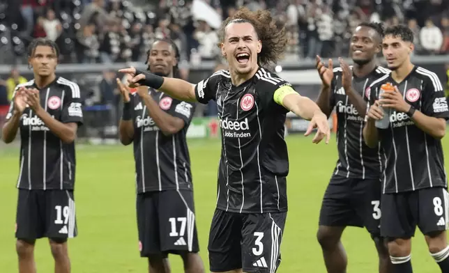 Frankfurt's Arthur Theate celebrates after winning the Champions League opening phase soccer match between Eintracht Frankfurt and Galatasaray Istanbul in Frankfurt, Germany, Thursday, Sept. 18, 2025. (AP Photo/Martin Meissner)