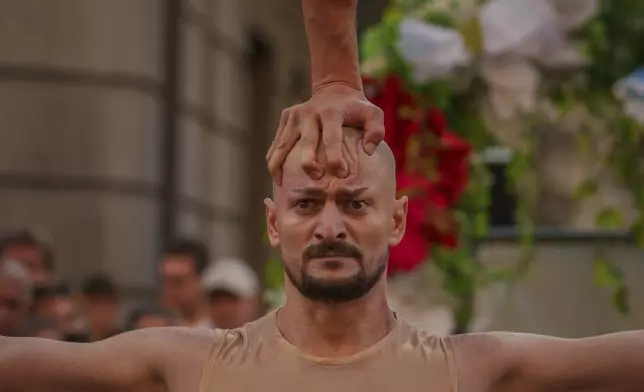 Artists of the Bucharest Metropolitan Circus perform during an event marking the day when the Romanian capital was first mentioned in historical records, 566 years ago, in Bucharest, Romania, Saturday, Sept. 20, 2025. (AP Photo/Vadim Ghirda)