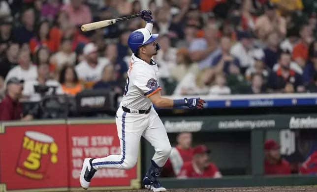 Houston Astros' Ramón Urías hits a home run against the Los Angeles Angels during the second inning of a baseball game Monday, Sept. 1, 2025, in Houston. (AP Photo/David J. Phillip)