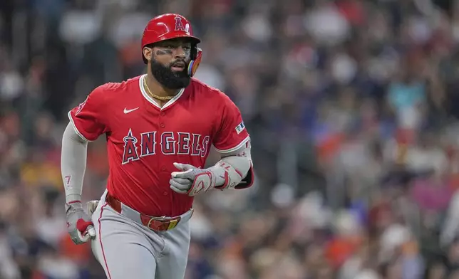 Los Angeles Angels' Jo Adell runs up the first base line after hitting a two-run home run against the Houston Astros during the fourth inning of a baseball game Monday, Sept. 1, 2025, in Houston. (AP Photo/David J. Phillip)