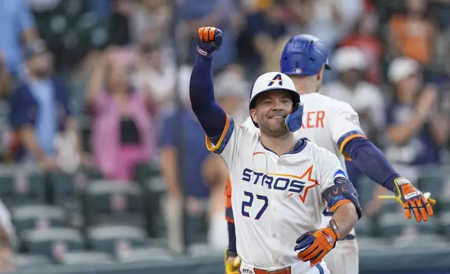 Houston Astros' Jose Altuve (27) celebrates after hitting a two-run home run against the Los Angeles Angels during the eighth inning of a baseball game Monday, Sept. 1, 2025, in Houston. (AP Photo/David J. Phillip)