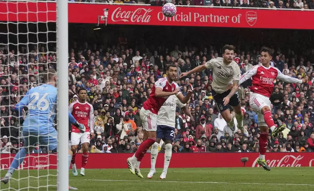 Arsenal's Martín Zubimendi, right, scores during the Premier League soccer match between Arsenal and Nottingham Forest in London, Saturday, Sept. 13, 2025. (AP Photo/Kin Cheung)
