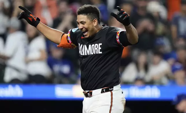 Baltimore Orioles' Samuel Basallo celebrates after hitting a walkoff home run during the ninth inning of a baseball game against the Los Angeles Dodgers, Friday, Sept. 5, 2025, in Baltimore. (AP Photo/Stephanie Scarbrough)
