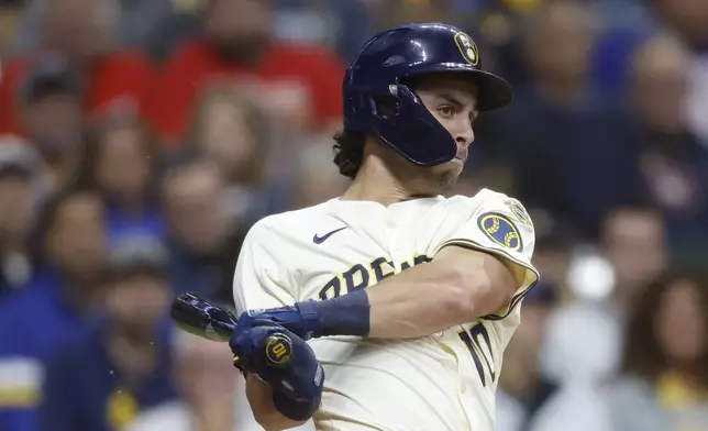 Milwaukee Brewers' Sal Frelick (10) hits a two-run single during the first inning of a baseball game against the Philadelphia Phillies, Wednesday, Sept. 3, 2025, in Milwaukee. (AP Photo/Jeffrey Phelps)