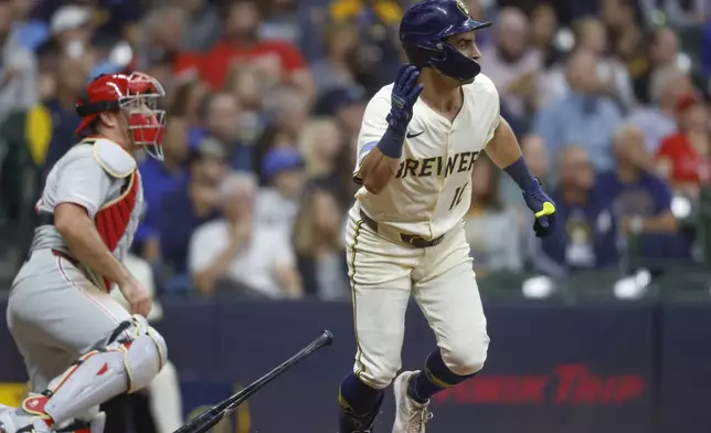 Milwaukee Brewers' Sal Frelick (10) hits a two-run single during the first inning of a baseball game against the Philadelphia Phillies, Wednesday, Sept. 3, 2025, in Milwaukee. (AP Photo/Jeffrey Phelps)